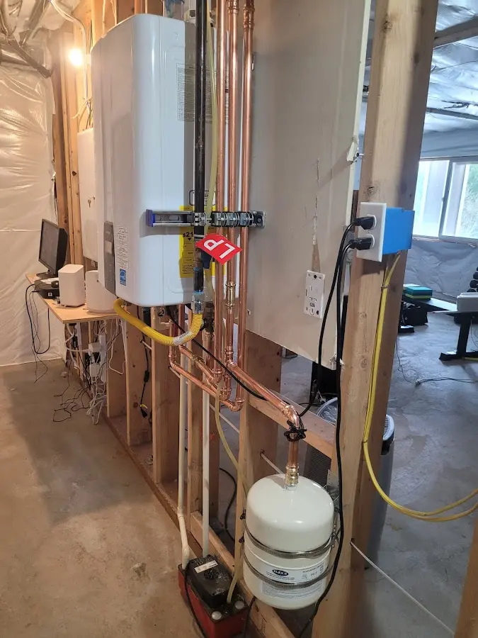 Licensed plumber repairing a kitchen sink in Gray